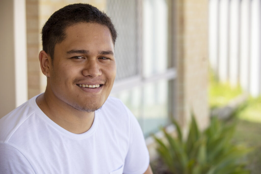 Portrait of a happy young Pacific Islander male enjoying his improved health after obesity surgery.